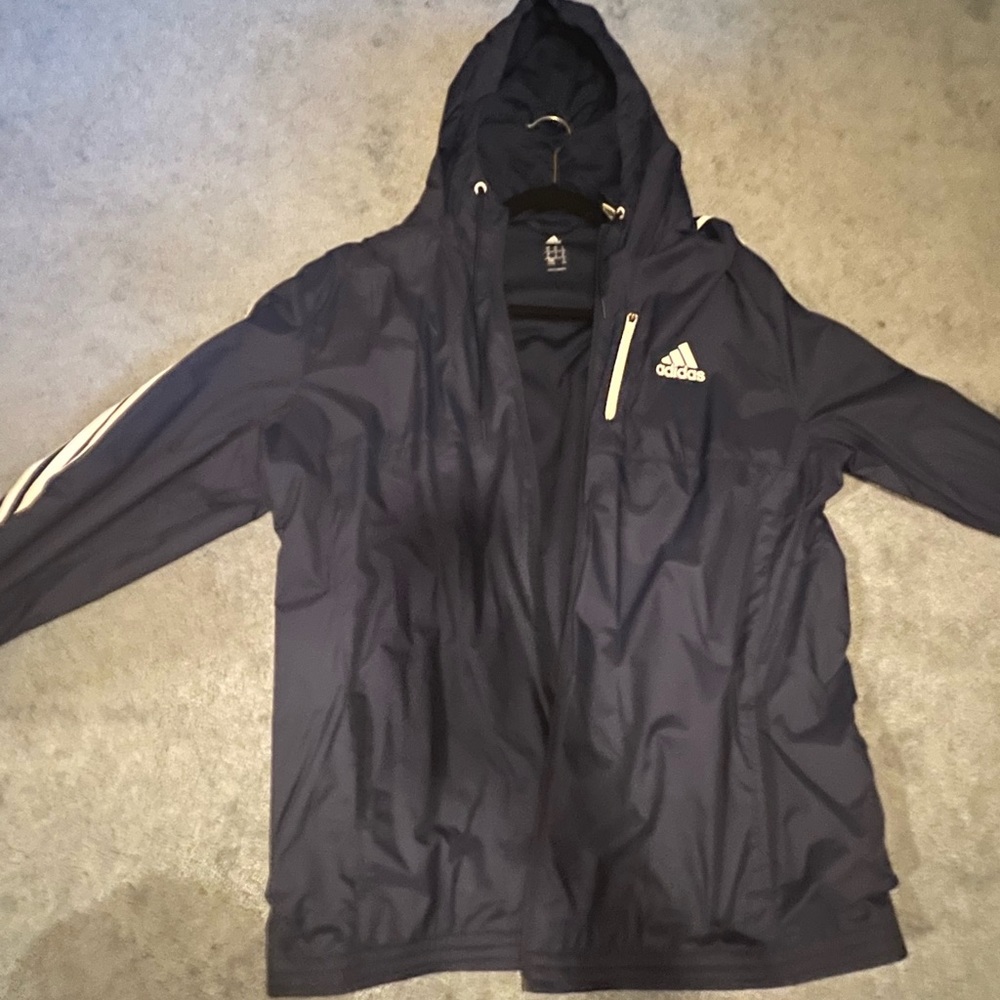 Adidas rain jacket in great condition, size large navy blue with white